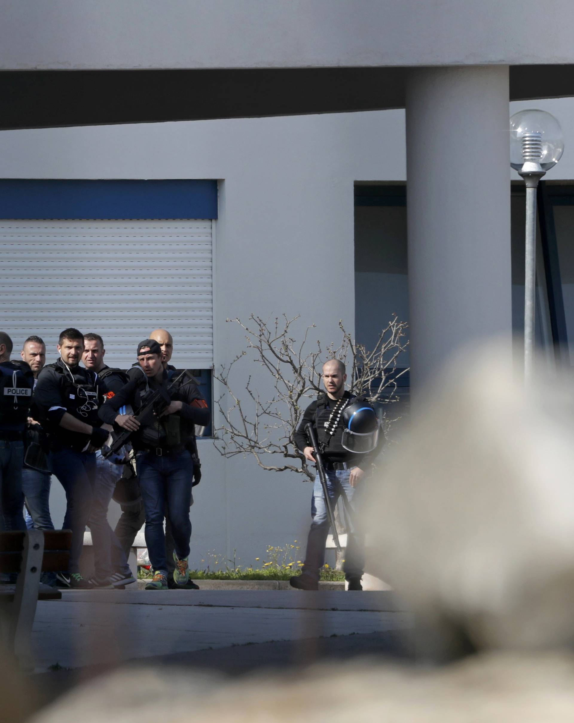 Police inside the Tocqueville high school after a shooting has taken place injuring at least eight people, in Grasse