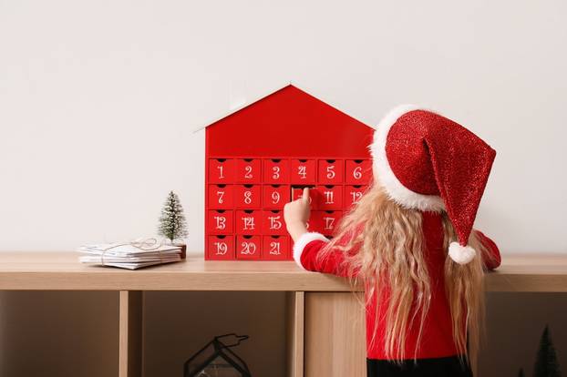 Cute,Little,Girl,,Christmas,Advent,Calendar,And,Letters,On,Shelf
