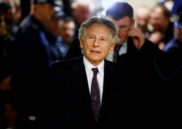 File photo of filmmaker Polanski walking on a corridor during a break of a court hearing in Krakow