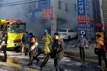 Smoke rises from a burning hospital in Miryang, South Korea