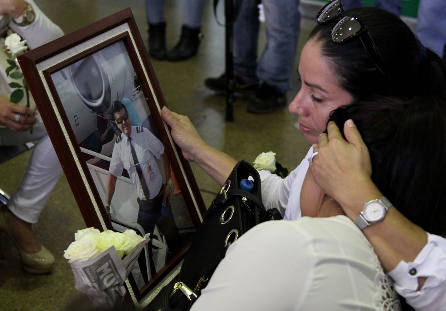 Relatives of Bolivian crew member David Vacaflor, who died when the plane carrying Brazilian soccer team Chapecoense crashed in Colombia, react at Viru Viru airport in Santa Cruz