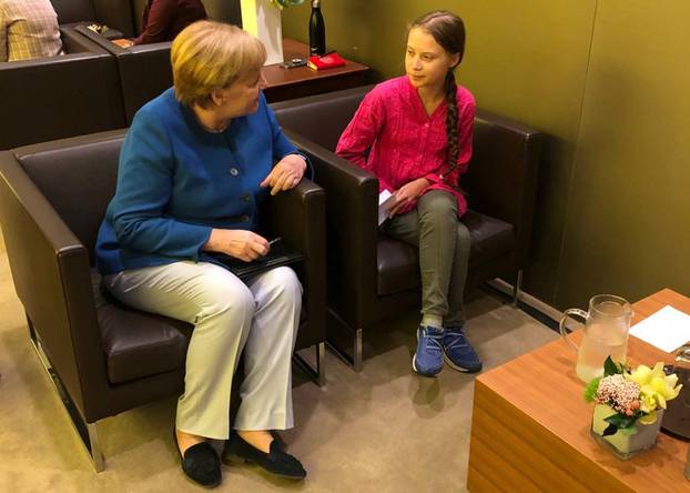 German Chancellor Merkel talks to Swedish climate activist Thunberg at U.N. headquarters in New York