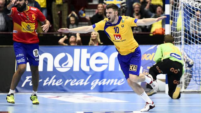 Sweden's Niclas Ekberg celebrates after scoring a penalty during the men's handball Olympic Qualification Tournament group 2 match against Spain at Malmo Arena in Malmo