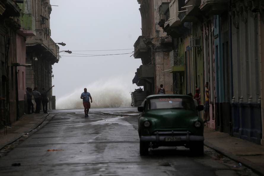 Waves crash on the street as Hurricane Irma turns toward the Florida Keys on Saturday, in Havana