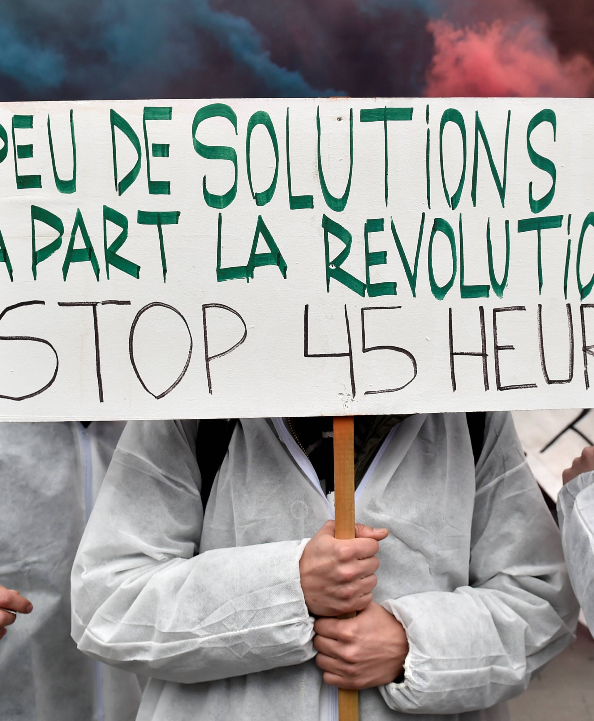 Demonstrators, protesting government reforms and cost-cutting measures, march in central Brussels