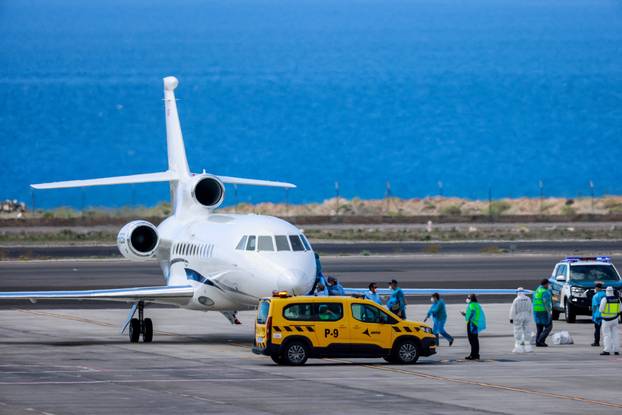 Passengers of the cruise ship MV Hondius, which was affected by a hantavirus outbreak, arrive at Tenerife Sud airport