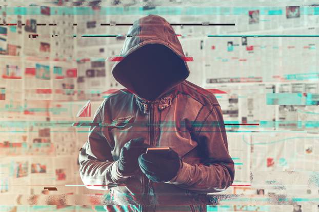 Hooded,Hacker,Person,Using,Smartphone,In,Infodemic,Concept,With,Digital