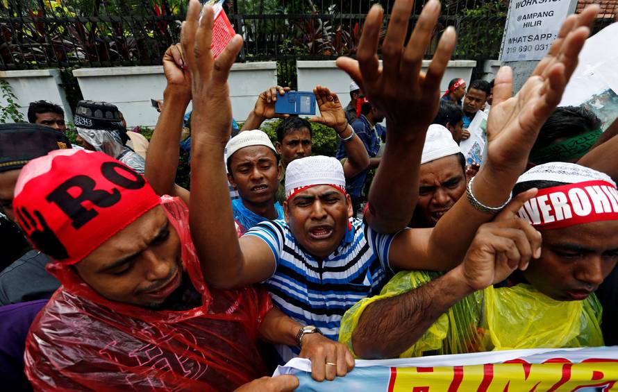 Rohingyas living in Malaysia protest against the treatment of Myanmar's Rohingya Muslims near the Myanmar embassy in Kuala Lumpur