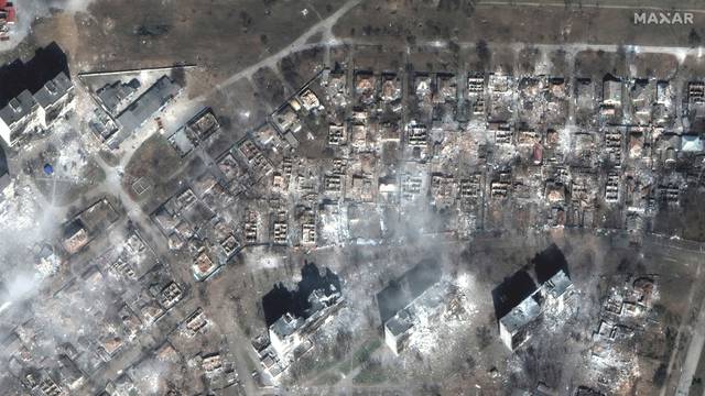 A satellite image shows apartment buildings and homes destroyed on east Mariupol