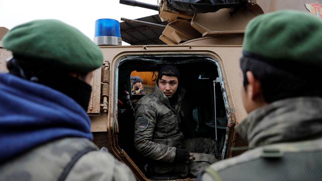 Turkey-backed Free Syrian Army police forces  escort a convoy near Azaz