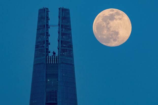 Lotte World Tower with moon, Seoul, South Korea - 26 Apr 2021