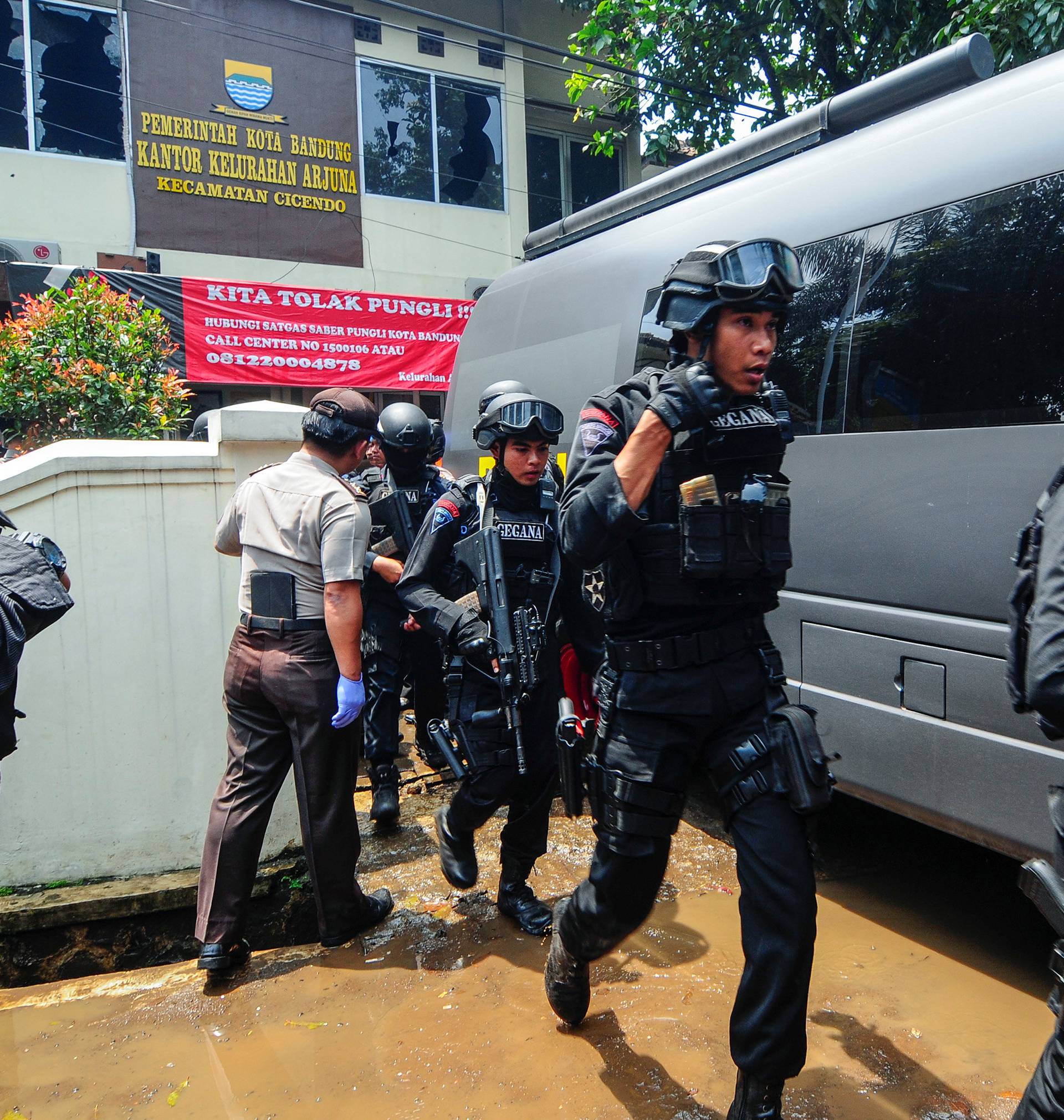 Police are seen outside a local government office following an explosion in Bandung, West Java, Indonesia