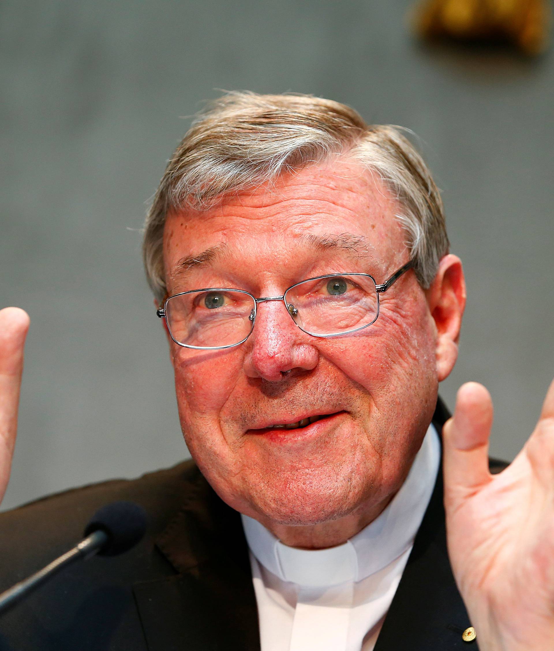 FILE PHOTO - Cardinal George Pell gestures as he talks during a news conference for the presentation of new president of Vatican Bank IOR, at the Vatican