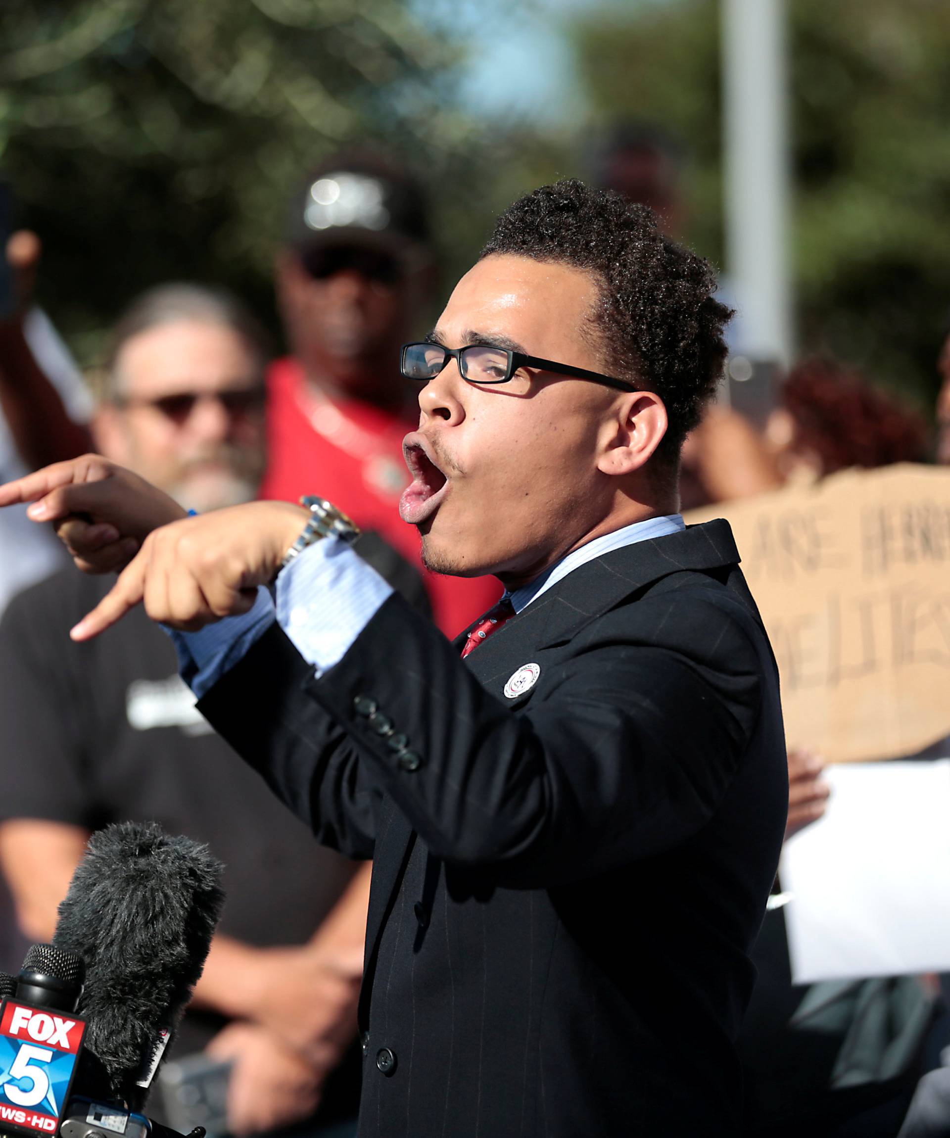 Protesters gather at the El Cajon Police Department headquarters to protest  fatal shooting of an unarmed black man Tuesday by officers in El Cajon, California