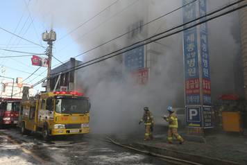 Smoke rise from a burning hospital in Miryang