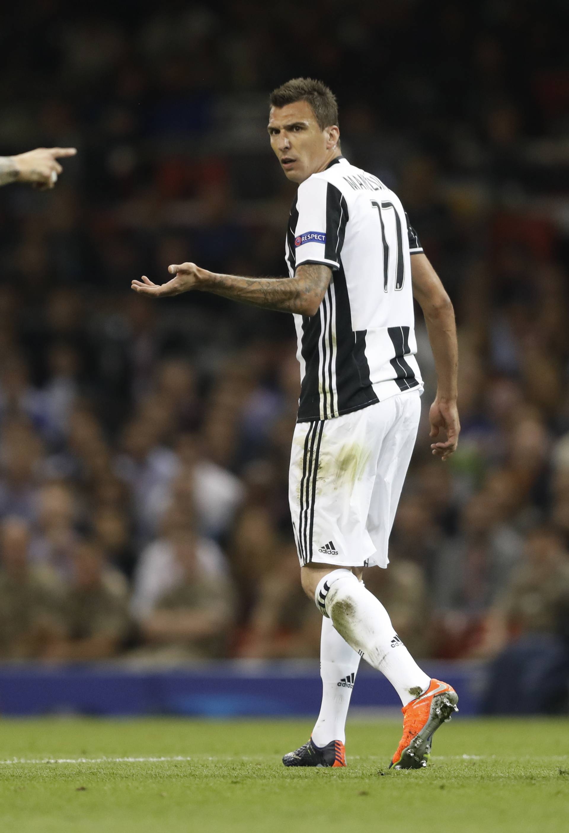 Real Madrid's Sergio Ramos clashes with Juventus' Mario Mandzukic