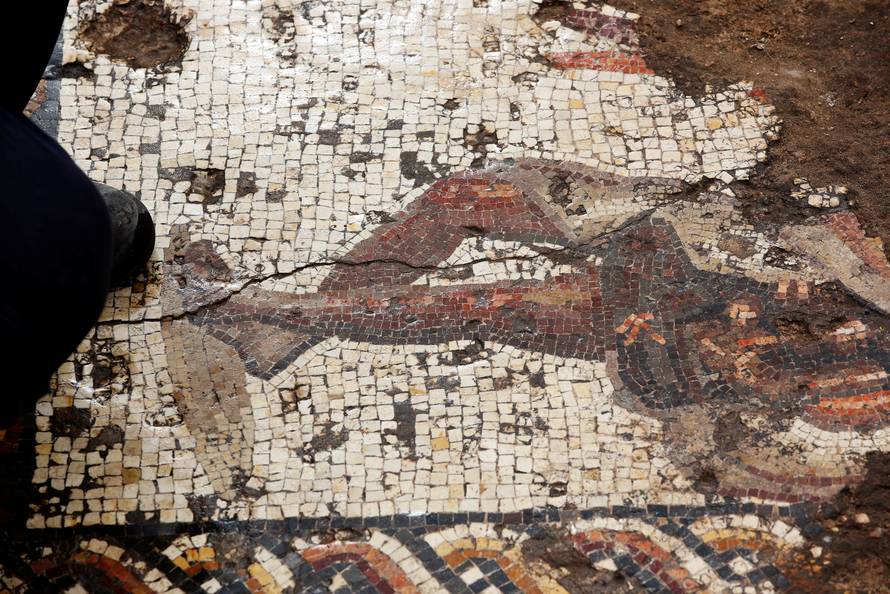 A decoration of a figure is seen on a mosaic floor which archaeologists say is 1,800 years old and was unearthed during an Israel Antiquities Authority excavation in Caesarea