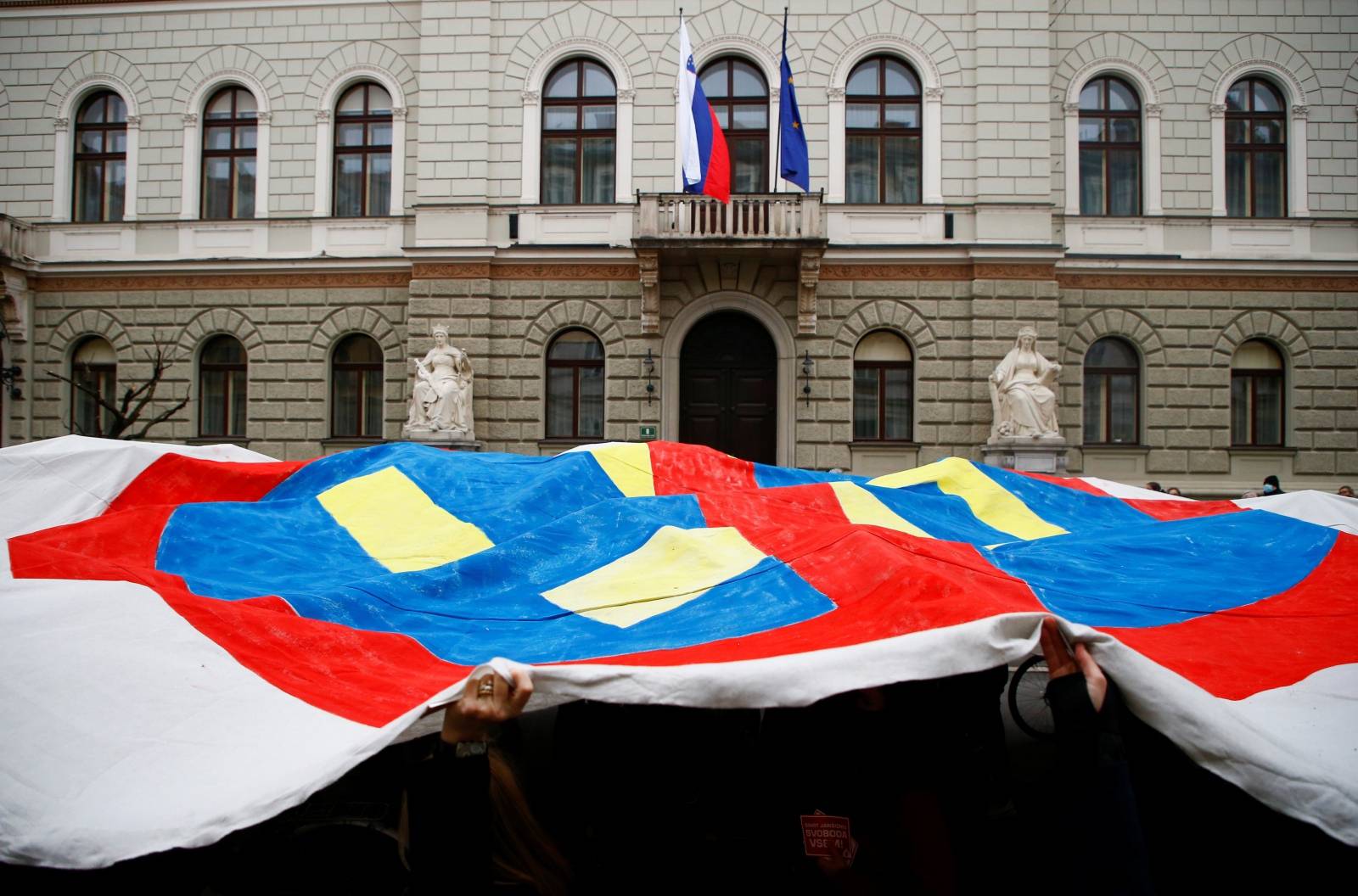 Demonstrators attend an anti-government protest in Ljubljana