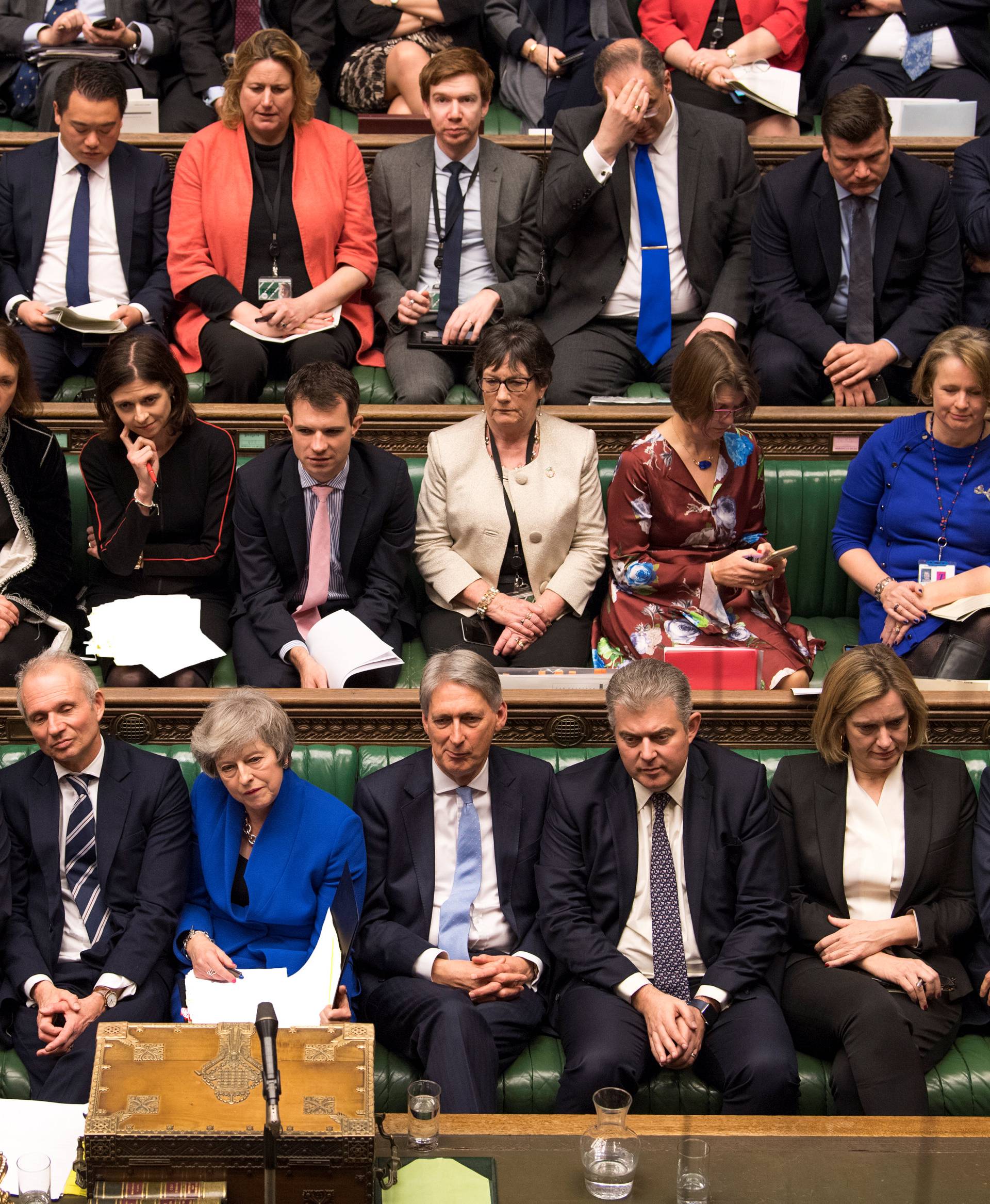 British Prime Minister Theresa May reacts during a no confidence debate after Parliament rejected her Brexit deal, in London