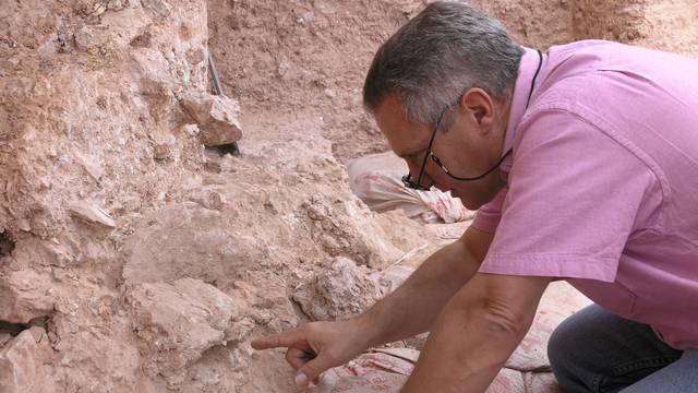 Dr. Jean-Jacques Hublin points out the new finds at Jebel Irhoud in Morocco in this handout photo