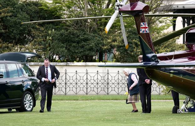 The Queen arrives at Kensington Palace by helicopter to meet Prince Louis for the first time as she brings a hand-picked bouquet of flowers as a gift for the Duchess of Cambridge