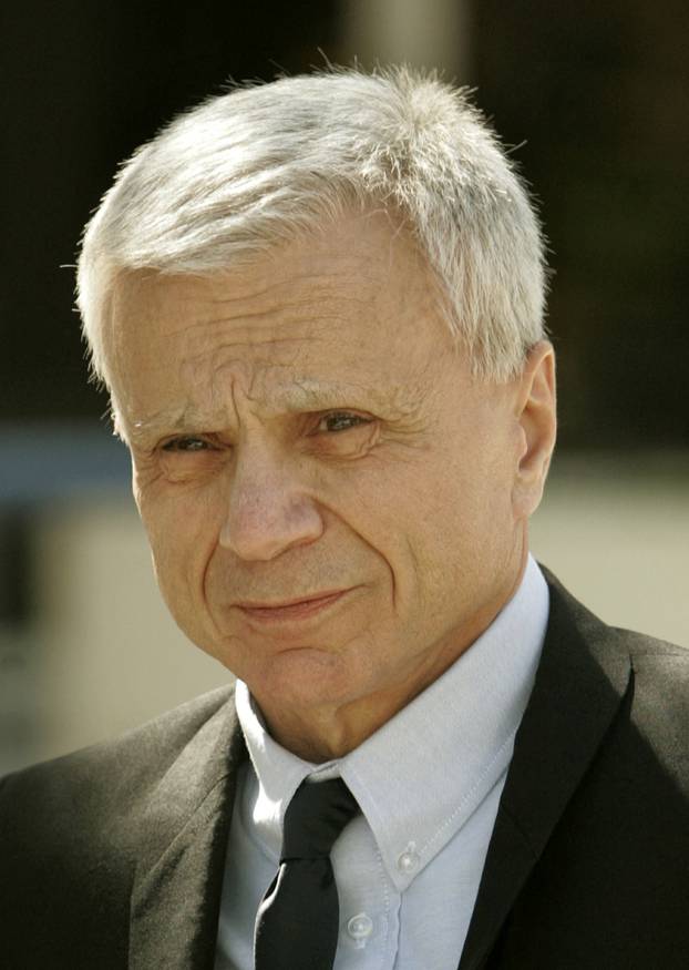 FILE PHOTO: Actor Robert Blake arrives at the Van Nuys courthouse to attend a court session in his murder trial, in Los Angeles