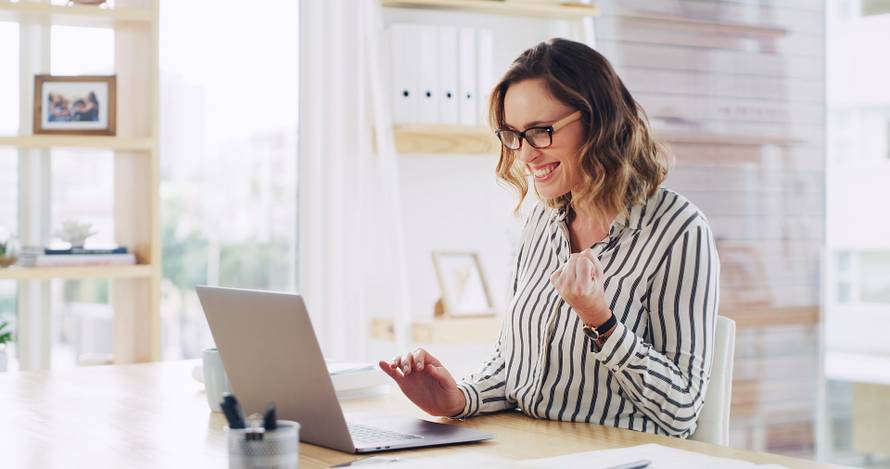 Fist,Pump,,Laptop,And,Winner,With,Business,Woman,At,Desk