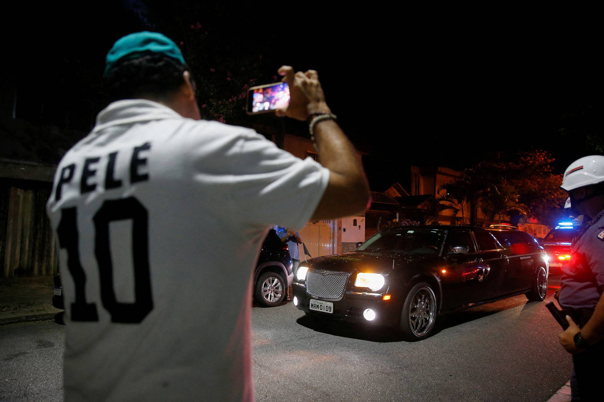 Vehicle transporting Brazilian soccer legend Pele's body arrives at the Vila Belmiro stadium in Santos