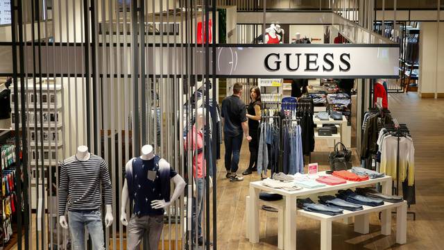 FILE PHOTO: Employees wait for customers in the Guess section in the Central Universal Department Store (TsUM) in Kiev