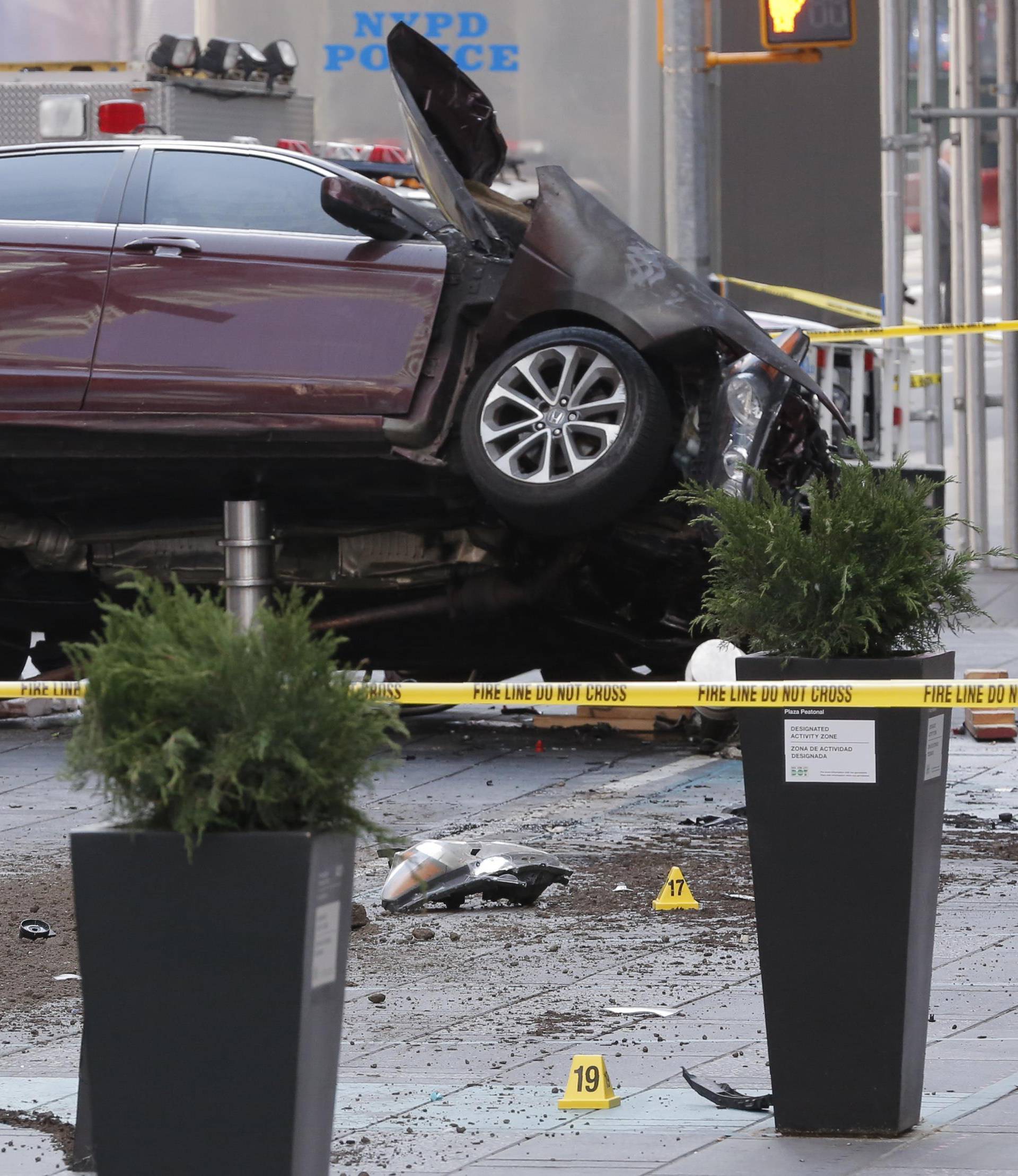 The remains of a vehicle are cordoned off in Times Square in New York