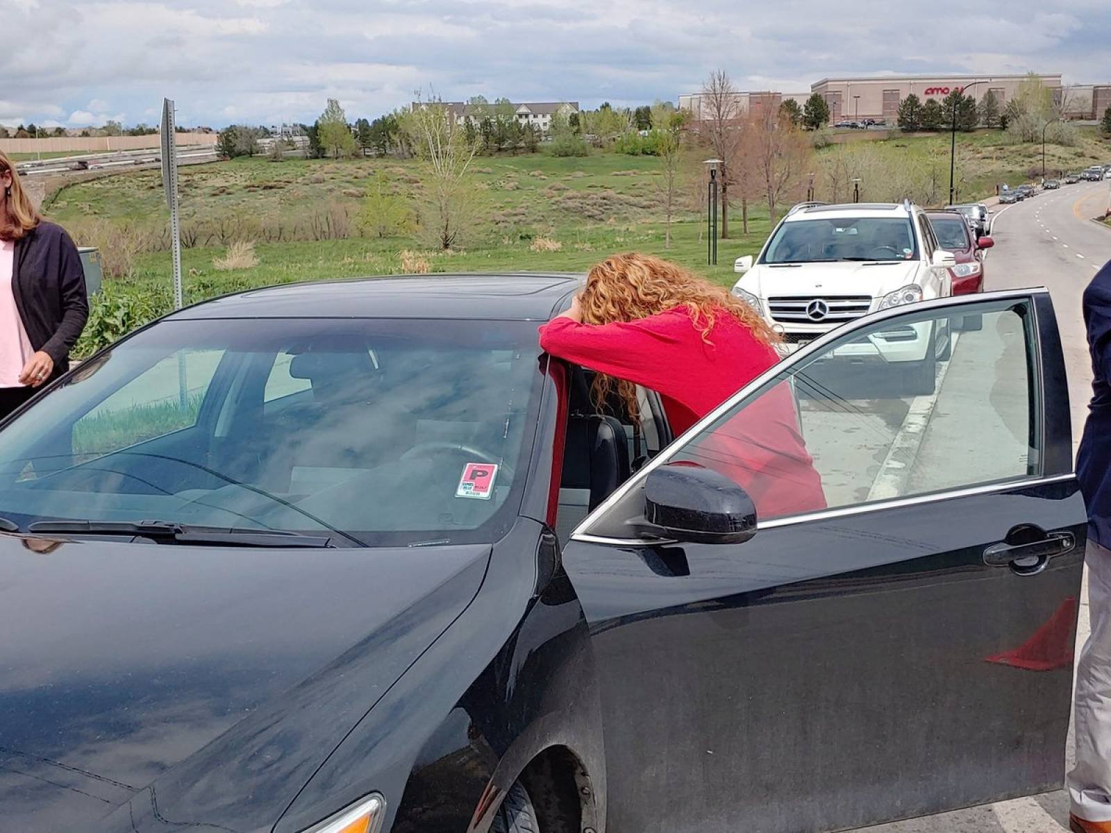 A parent reacts near the STEM School during a shooting incident in Highlands Ranch, Colorado, U.S. in this May 7, 2019 image obtained via social media