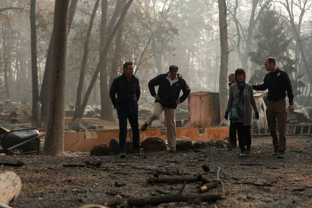 President Donald Trump visits the charred wreckage of Skyway Villa Mobile Home and RV Park with Governor-elect Gavin Newsom Brock Long Paradise Mayor Jody Jones and Governor Jerry Brown in Paradise California