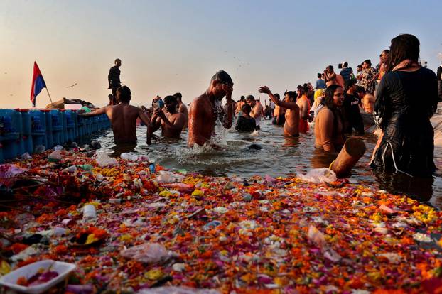 Devotees take a dip at Sangam during "Maha Kumbh Mela" in Prayagraj