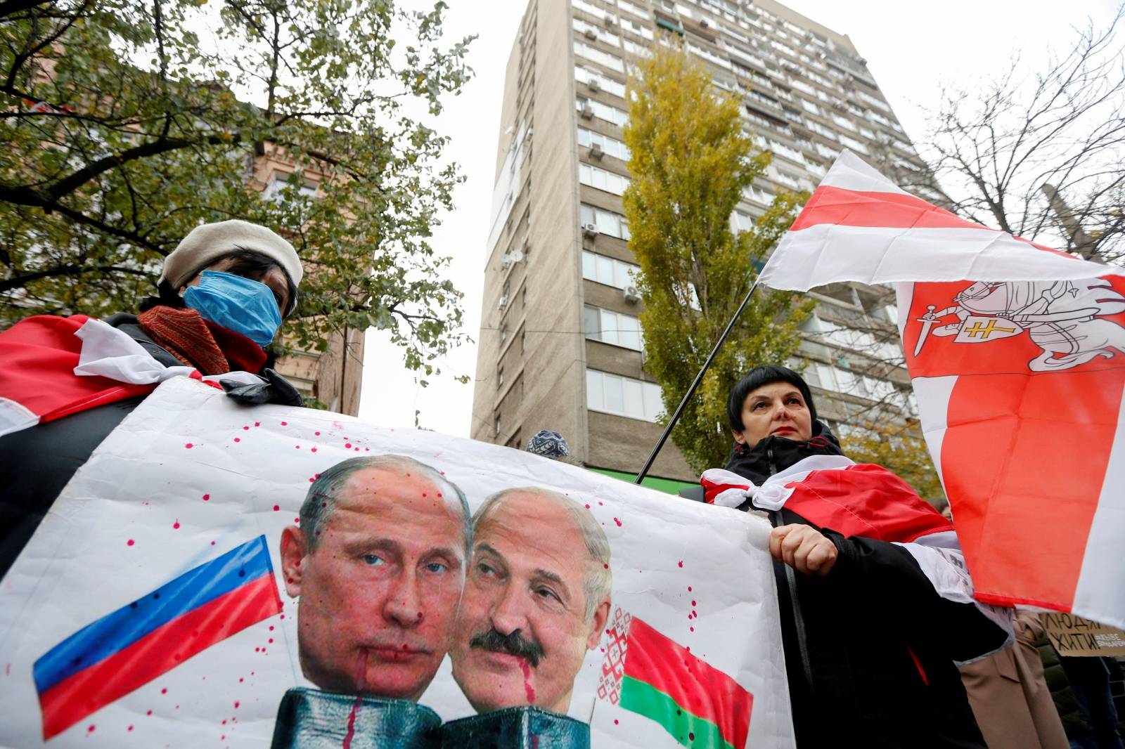 FILE PHOTO: People mourn the death of Belarusian anti-government protester Roman Bondarenko in Kyiv