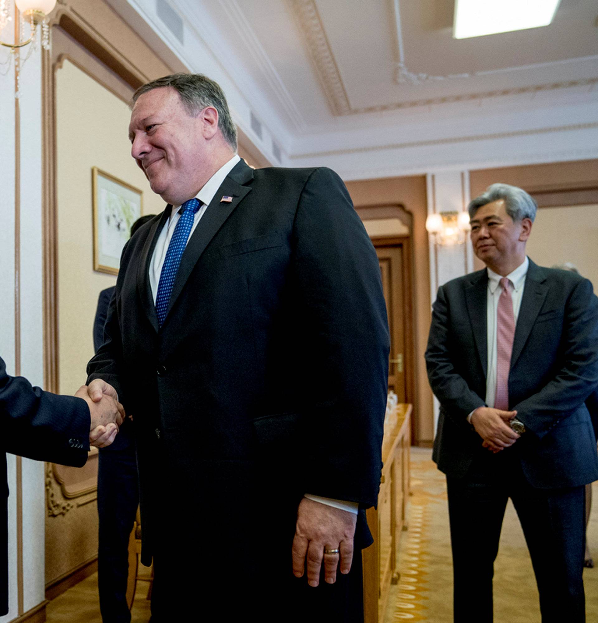 U.S. Secretary of State Mike Pompeo greets North Korean Director of the United Front Department Kim Yong Chol as they arrive for a meeting at the Park Hwa Guest House in Pyongyang