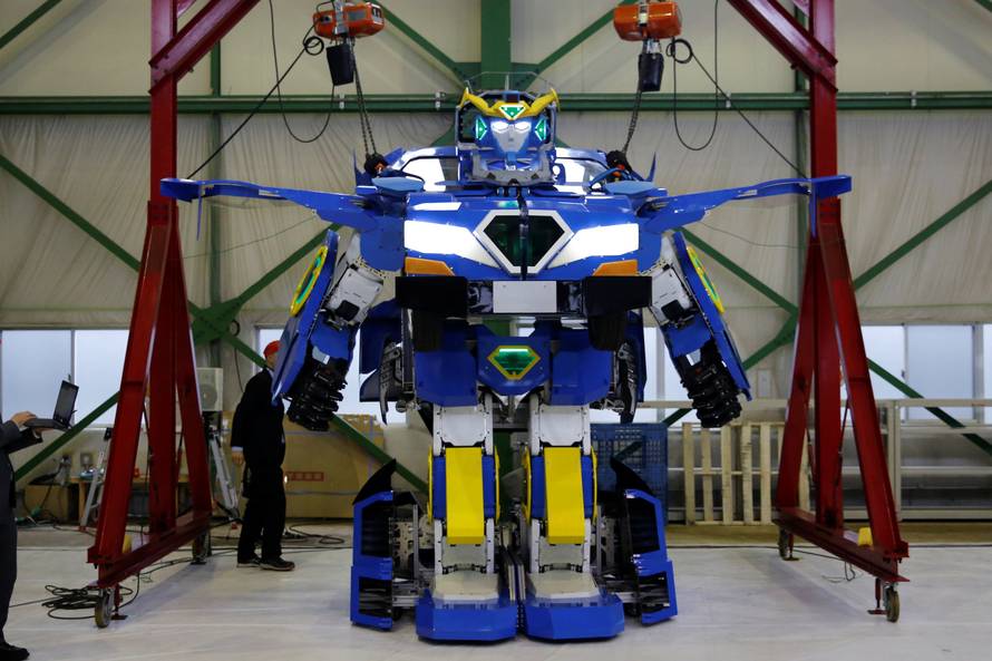 New transforming robot called "J-deite RIDE" that transforms itself into a passenger vehicle, developed by Brave Robotics Inc, Asratec Corp and Sansei Technologies Inc, demonstrates during its unveiling at a factory near Tokyo