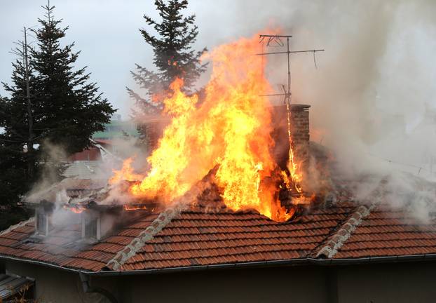 Burning house roof