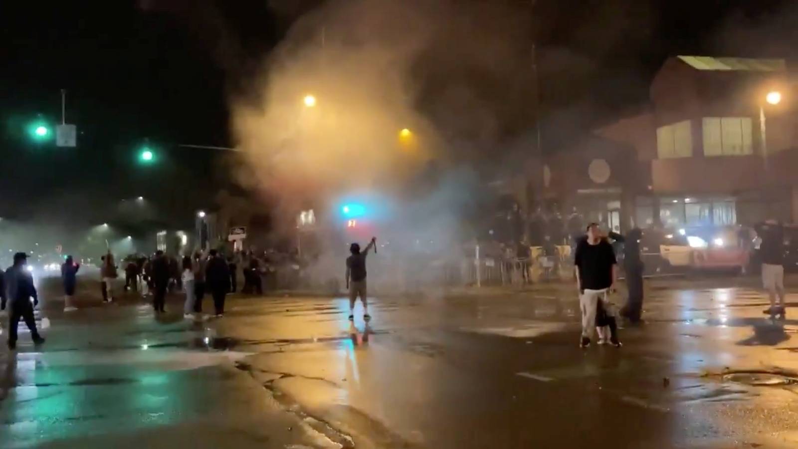 Still image shows police reportedly using tear gas and flash grenades against protesters demonstrating after the death of George Floyd in Minneapolis