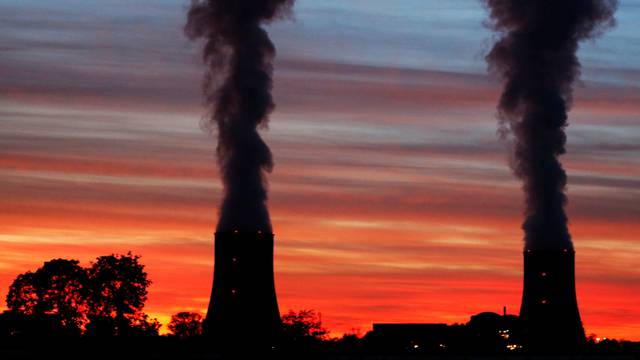 Cooling towers at the Golfech nuclear plant are pictured during sunset on the edge of the Garonne river between Agen and Toulouse