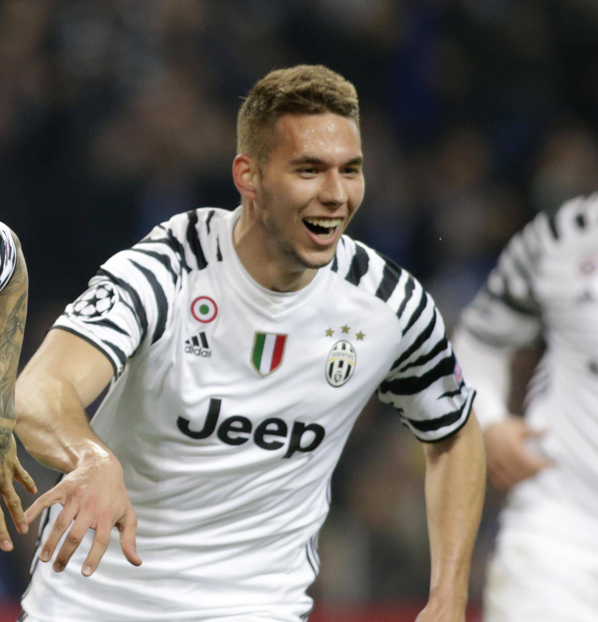 Juventus' Dani Alves celebrates scoring their second goal with Marko Pjaca