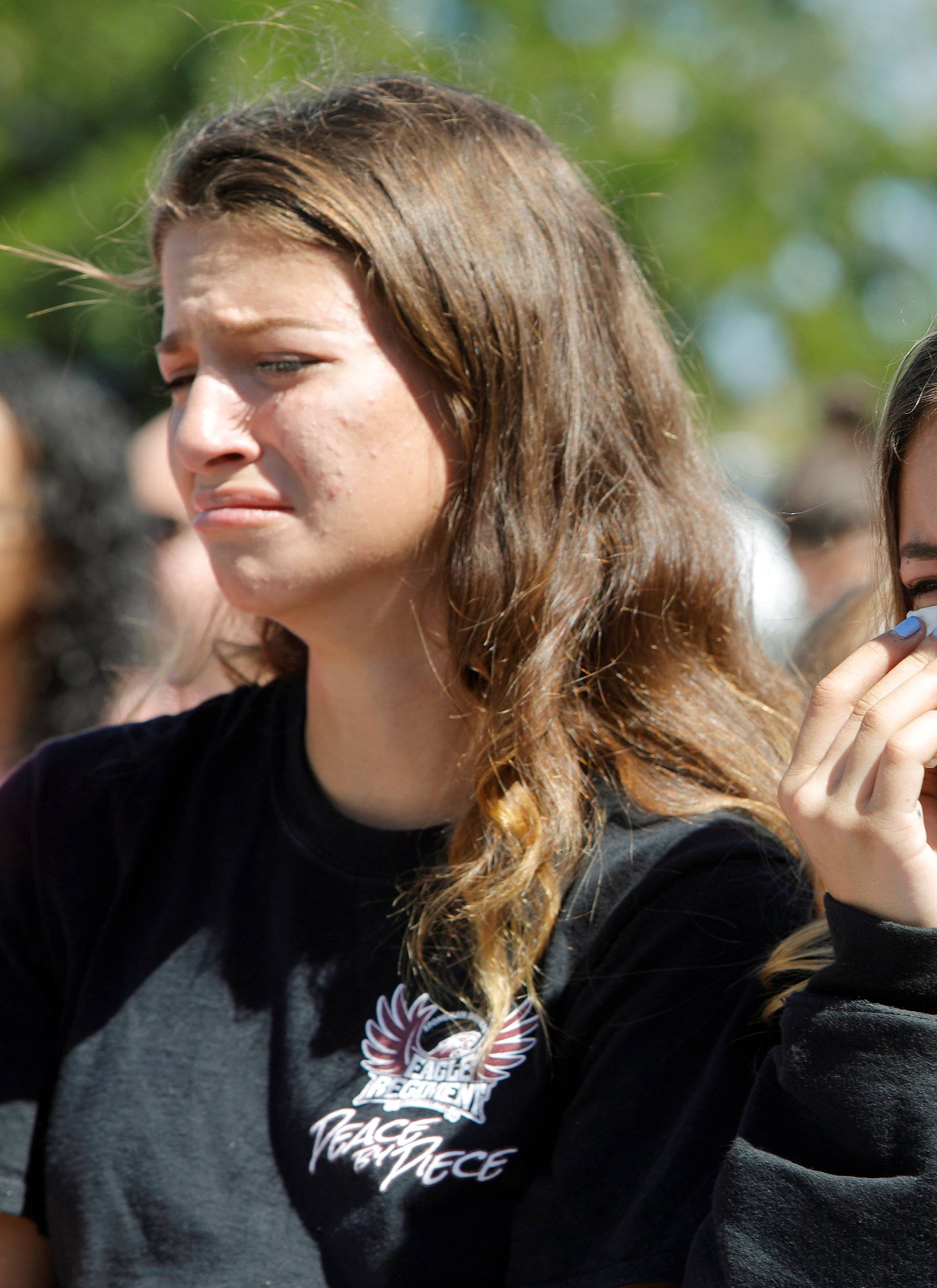 Students mourn during a community prayer vigil at Parkridge Church in Pompano Beach