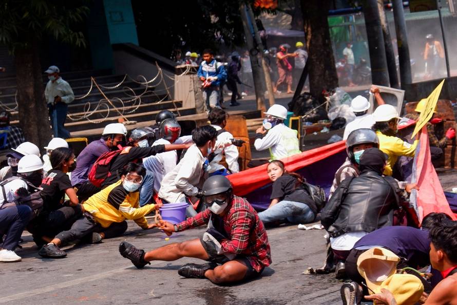 Angel takes cover before being shot in the head in Mandalay