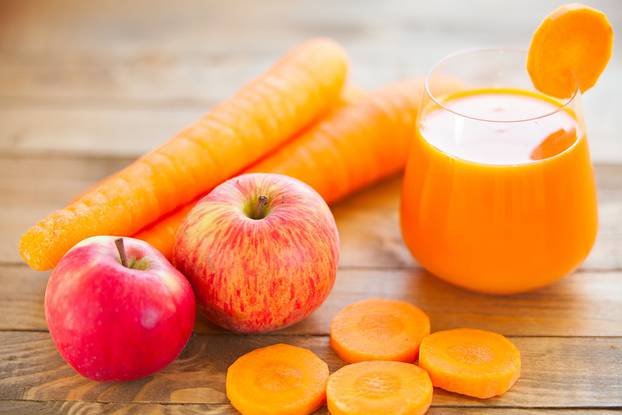 Carrot juice in glass on  table