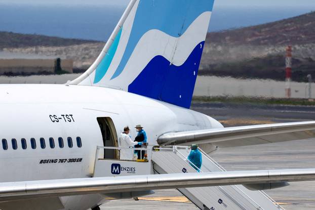 Passengers of the cruise ship MV Hondius, which was affected by a hantavirus outbreak, arrive at Tenerife Sud airport