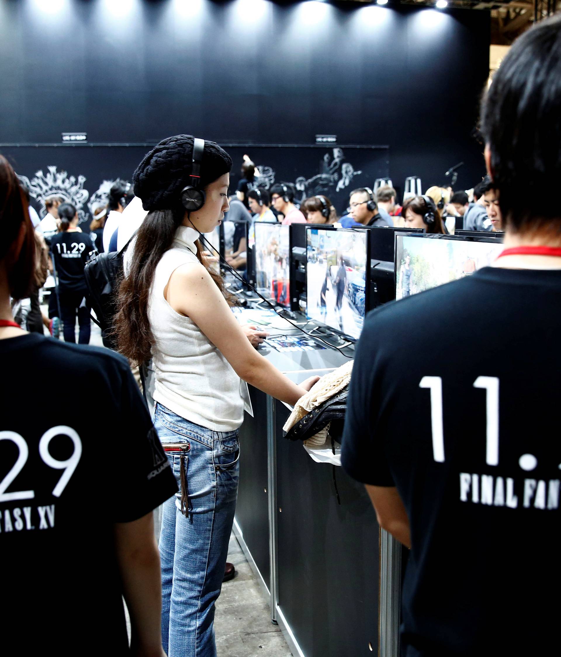 People play the video game 'Final Fantasy XV' at Tokyo Game Show 2016 in Chiba