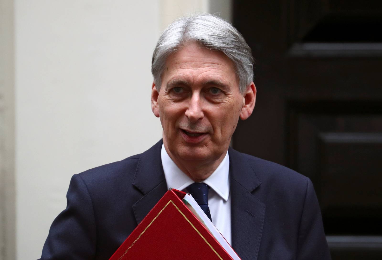 Britain's Chancellor of the Exchequer Philip Hammond is seen outside Downing Street in London