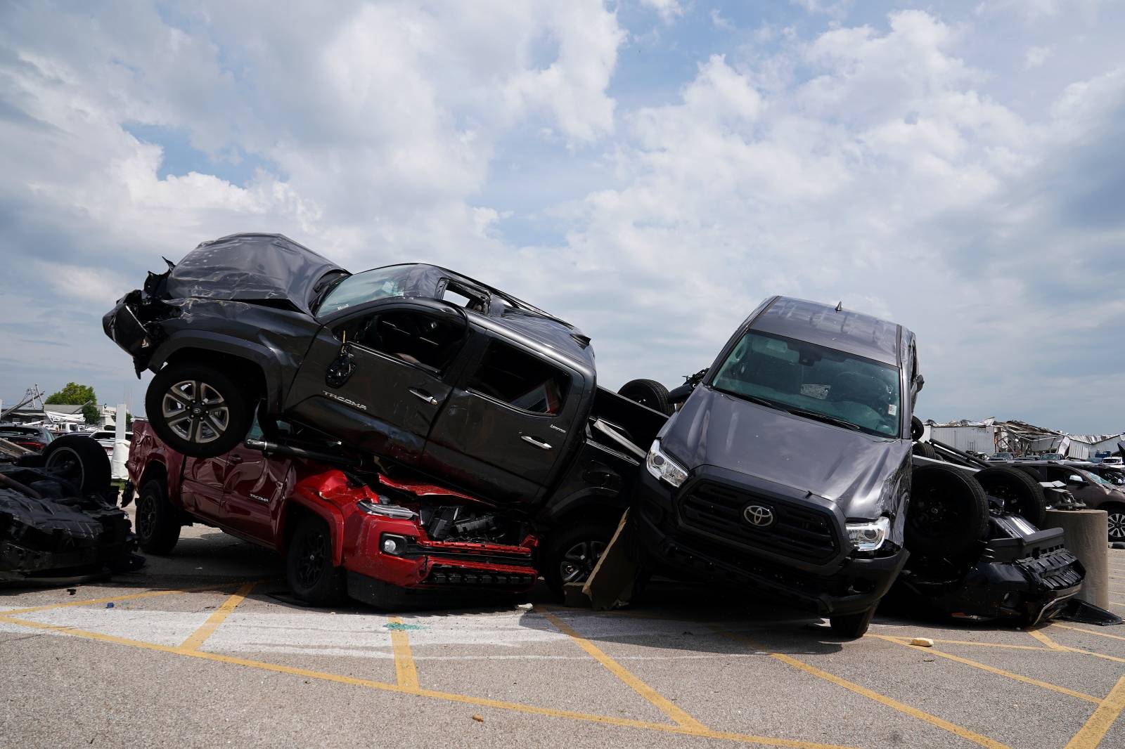 Wrecked vehicles are pictured at a Toyota dealer following a tornado in Jefferson City