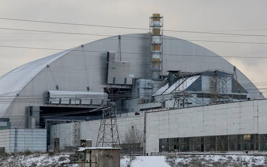 A general view shows a New Safe Confinement structure over the old sarcophagus covering the damaged fourth reactor at the Chernobyl nuclear power plant, in Chernobyl