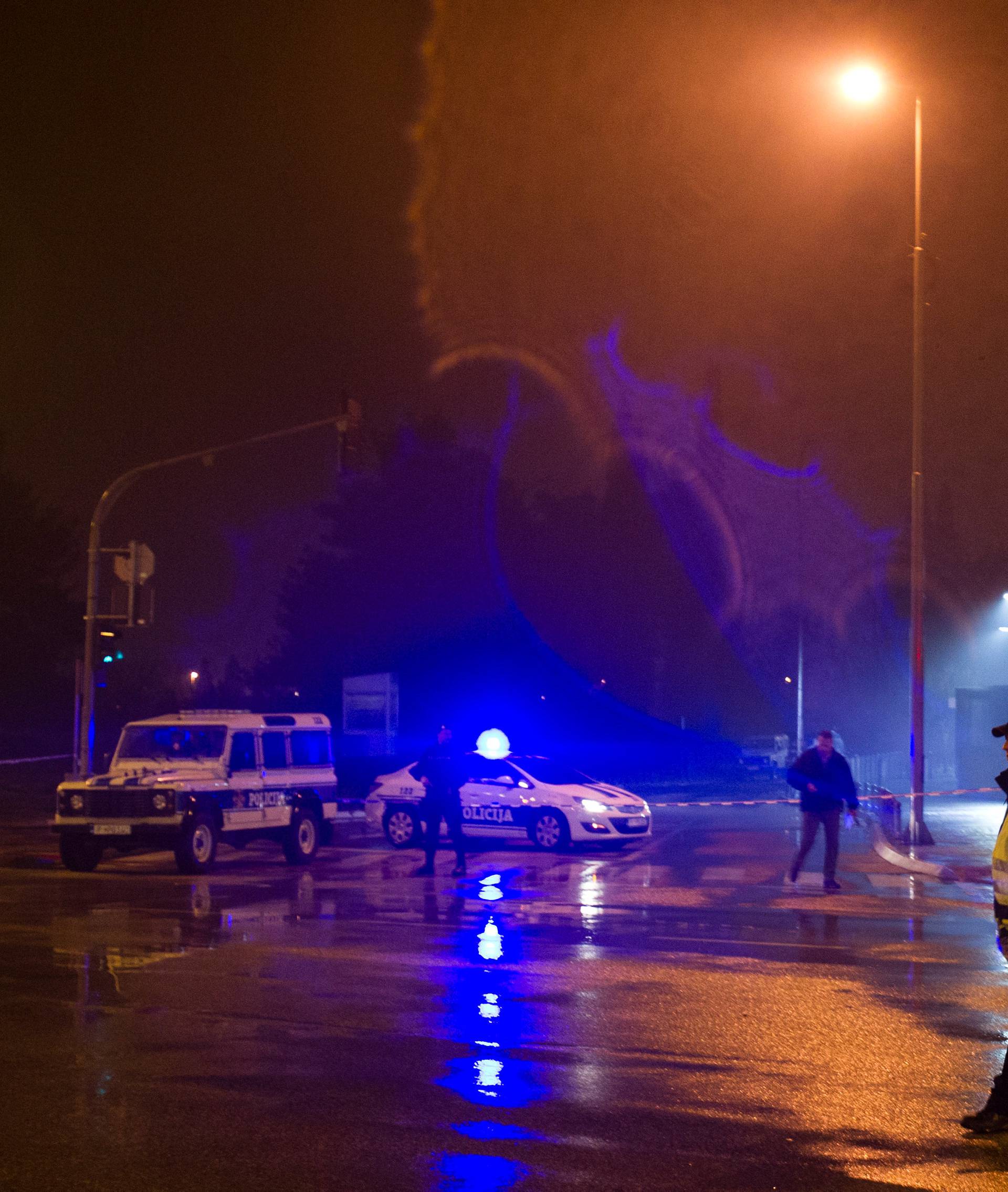 Police guard the entrance to the United States embassy building in Podgorica