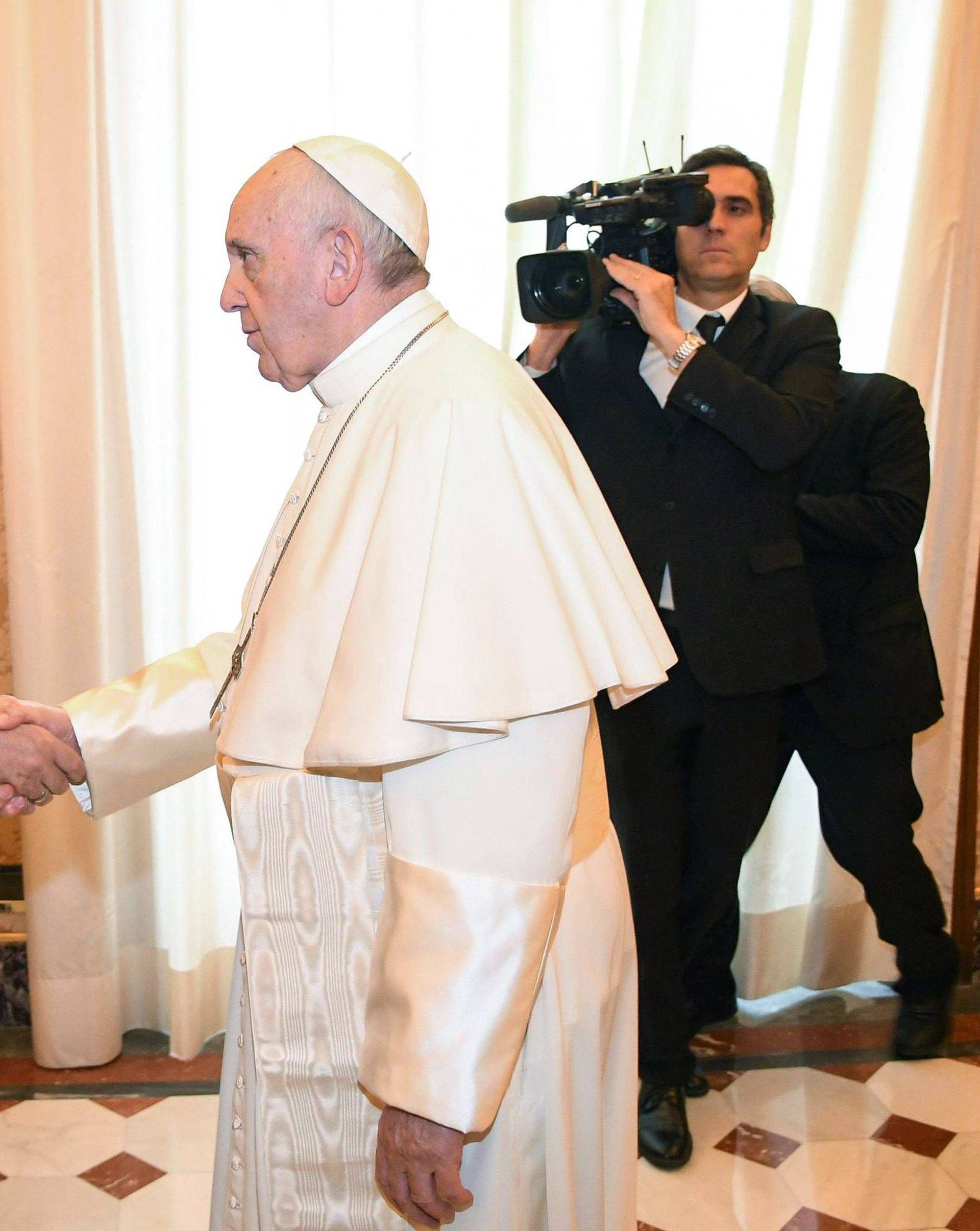 Pope Francis welcomes Turkish President Tayyip Erdogan during a private audience at the Vatican